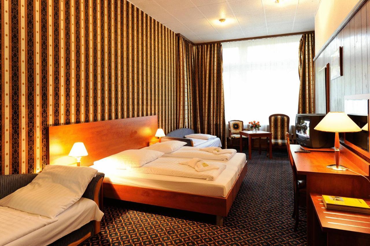 シティ ホテル アム クアフュルステンダム ベルリン 部屋 写真